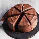 Decorative photograph of sliced chocolate cake